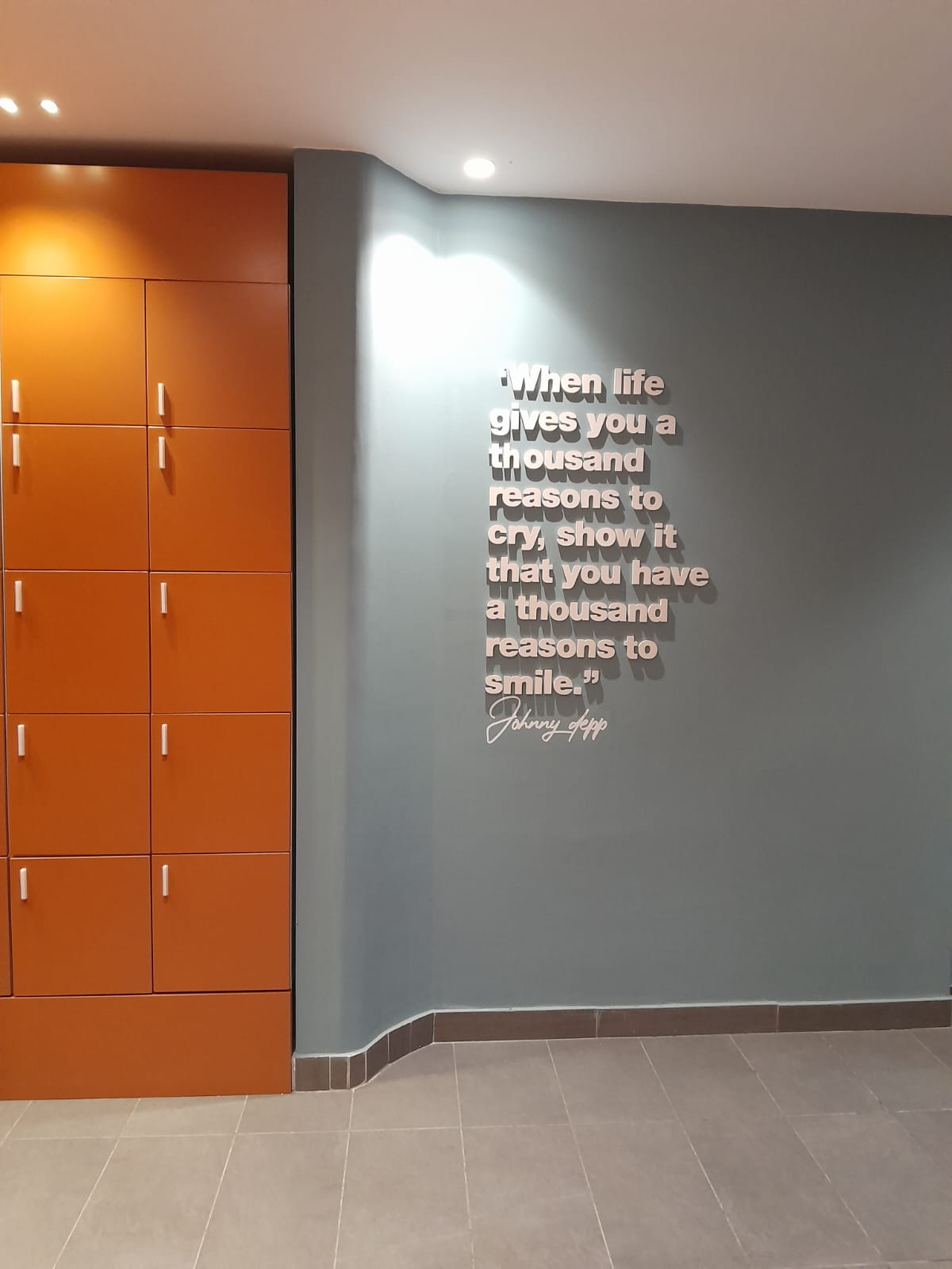Mural quote and orange lockers