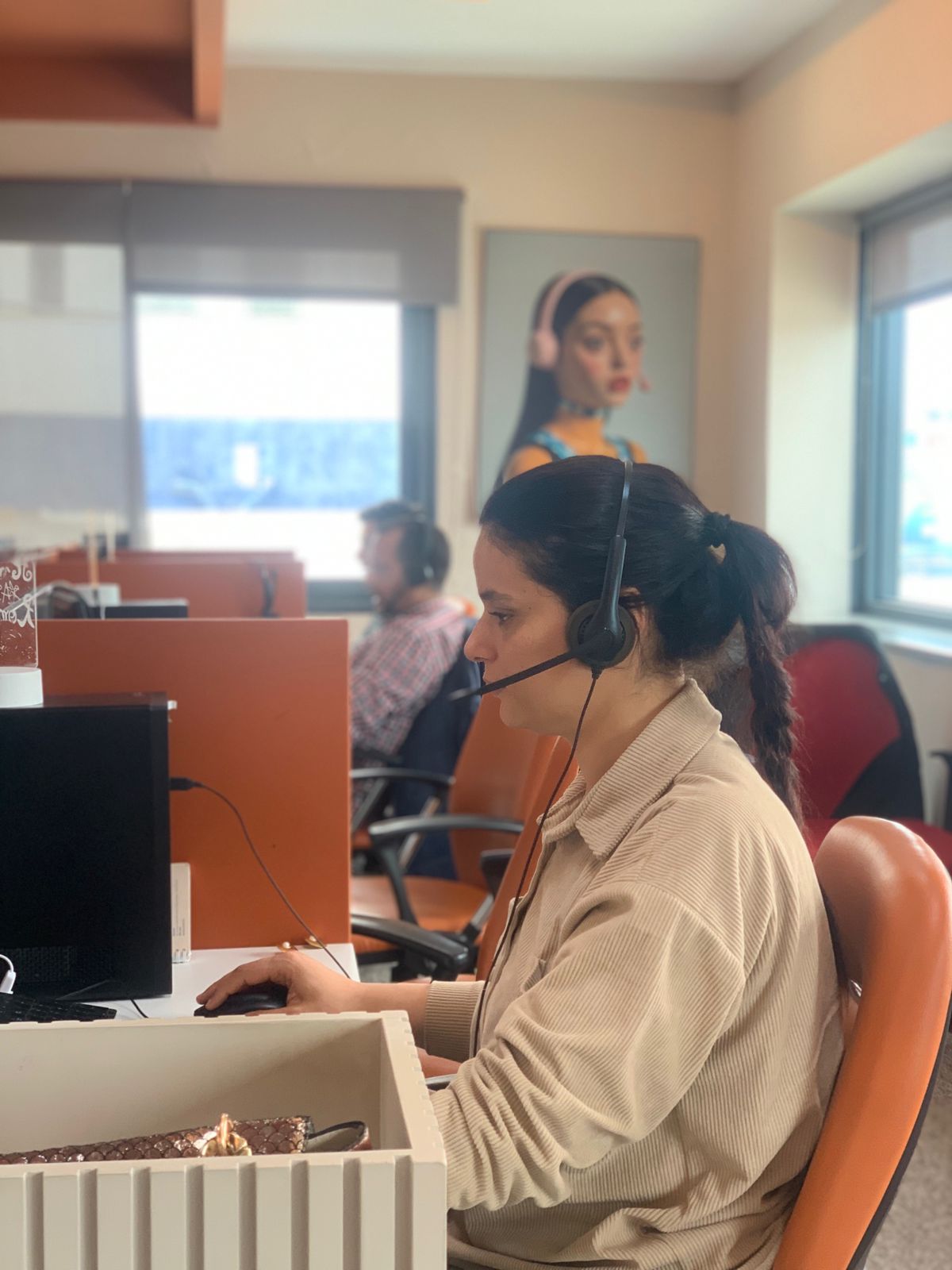 PolyCall agent with headset on the floor